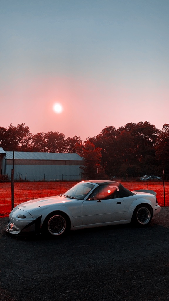 Custom vinyl wrapped Mazda Miata at sunset