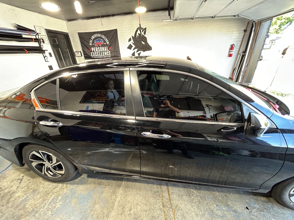 Black Sedan in Shop