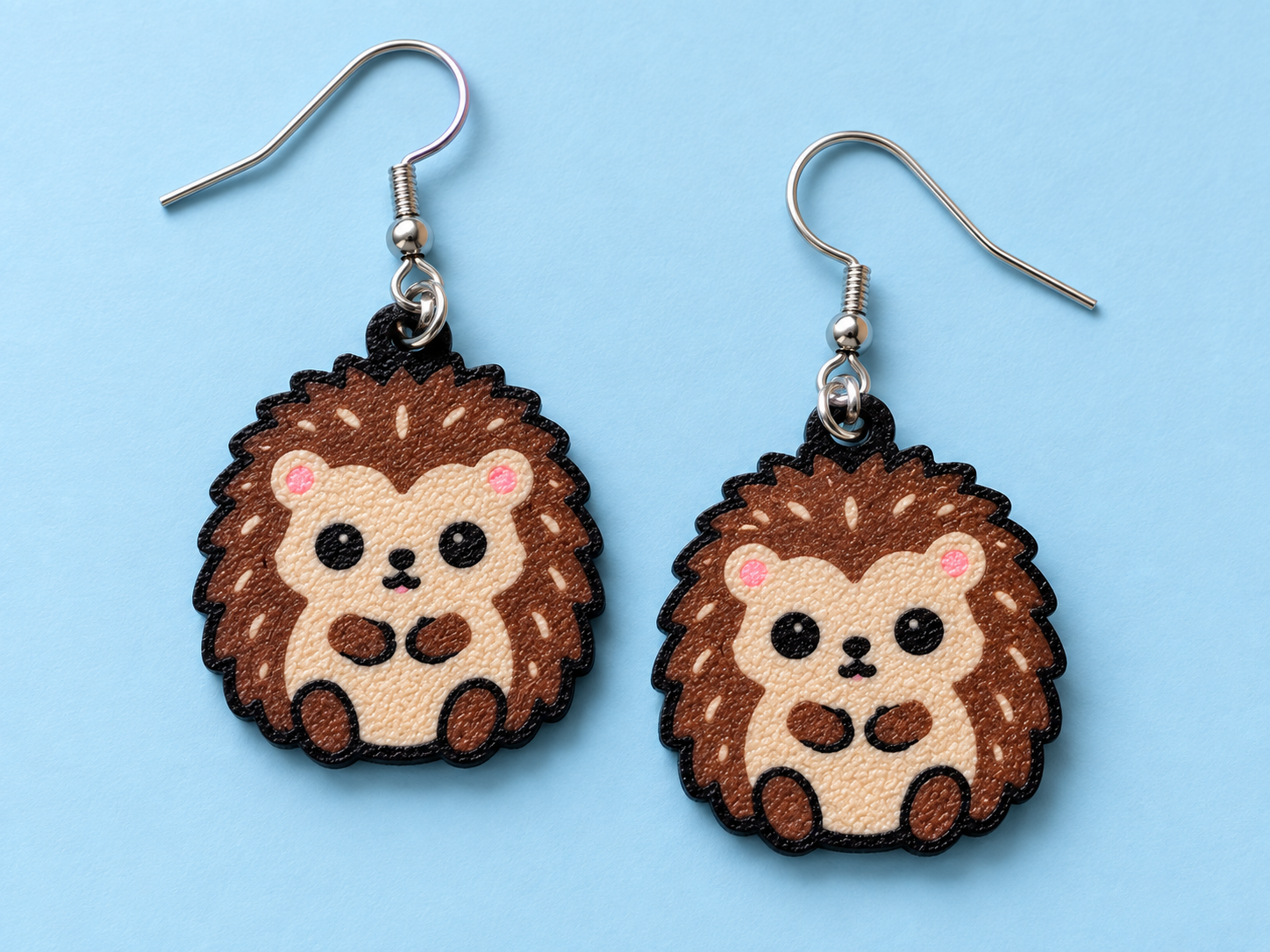 Hedgehog earrings with tan faces, brown quills and pink blush cheeks
