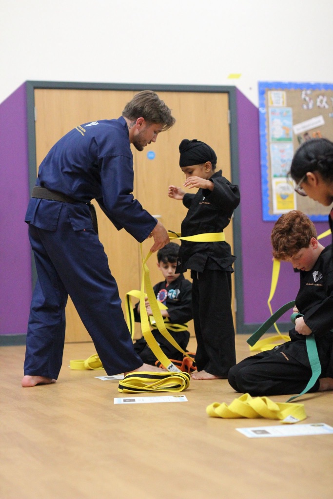 Belt ceremony — new grade awarded