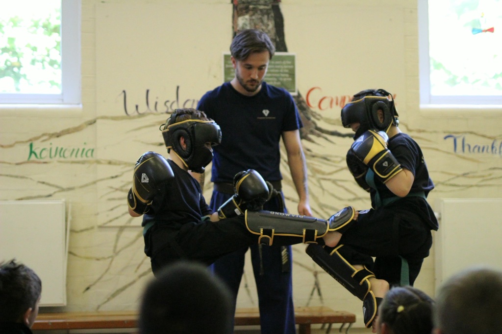 Coach and students — sparring supervision