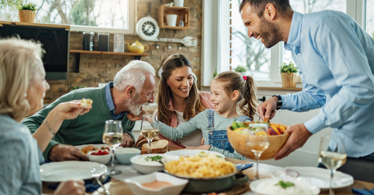 Multi-generational Jewish family sharing a meal together