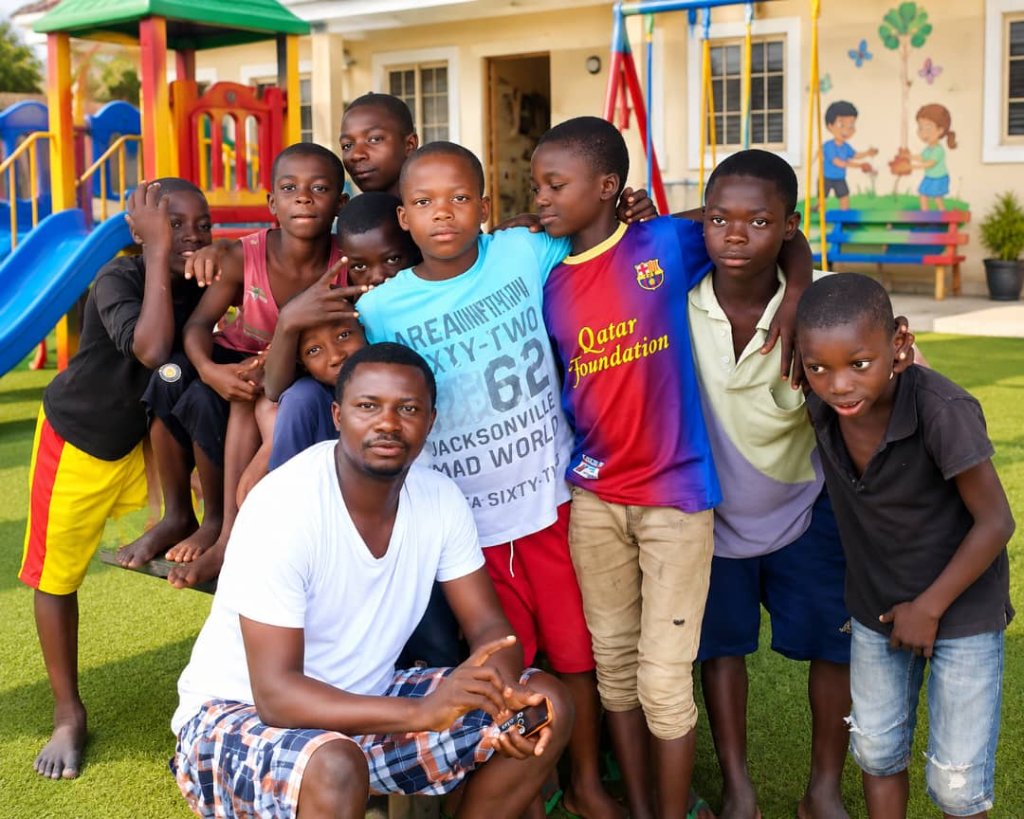 A volunteer engaging with the children