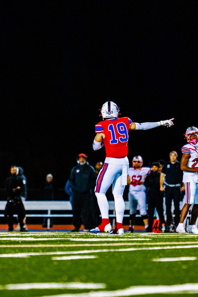 Austin Barber pointing downfield, directing the offense for DeMatha