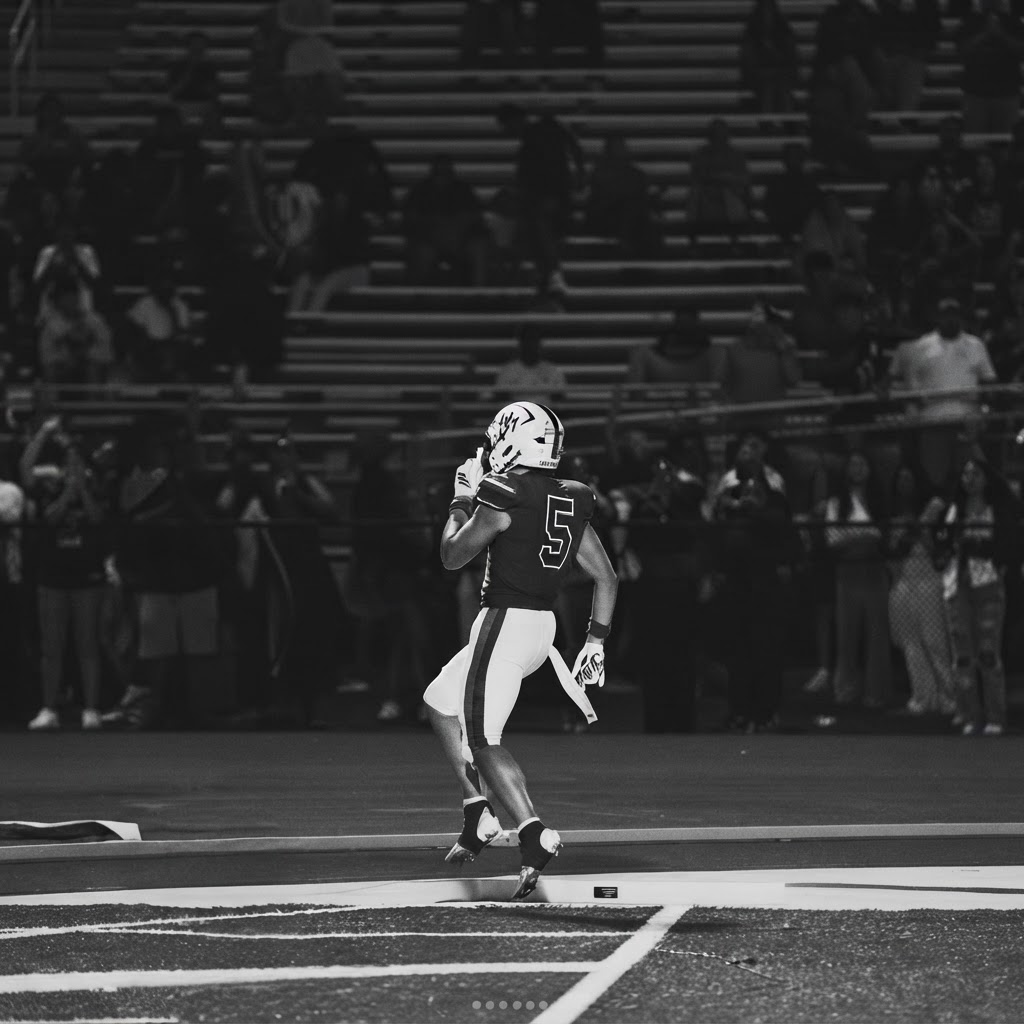 Austin Barber on the field under Friday night lights at DeMatha