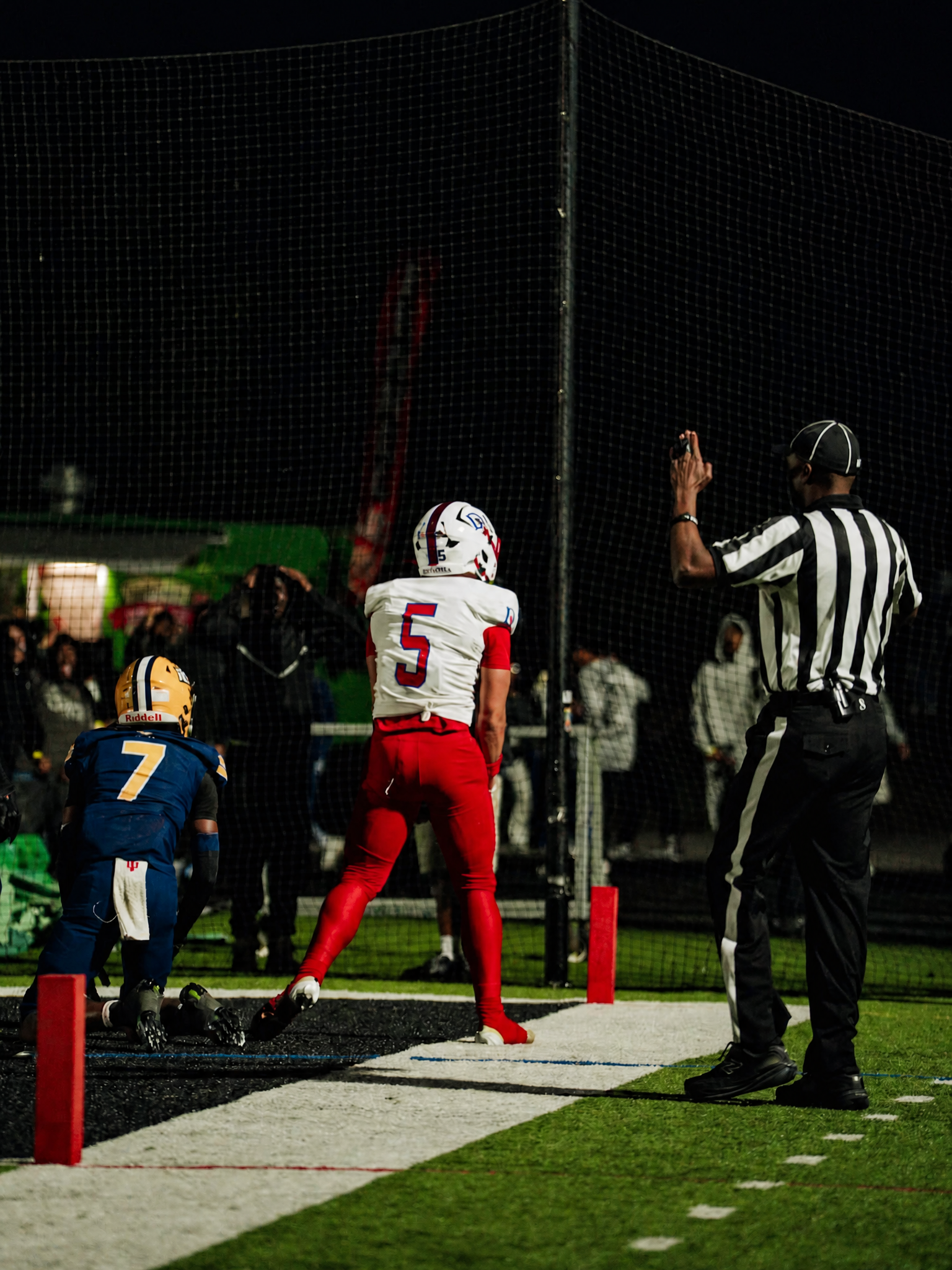 Austin Barber set near the end zone in his white DeMatha jersey