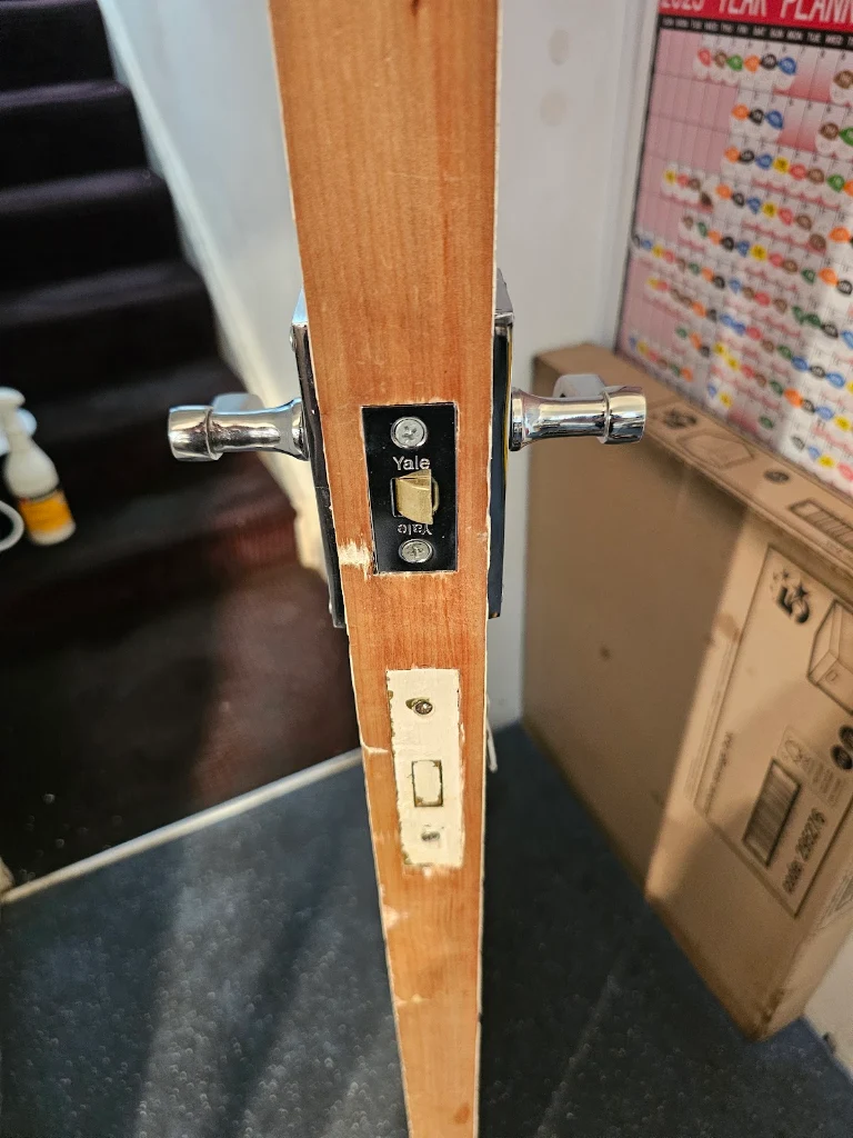 Yale mortice latch fitted to the edge of a wooden door by SIDE Locksmiths