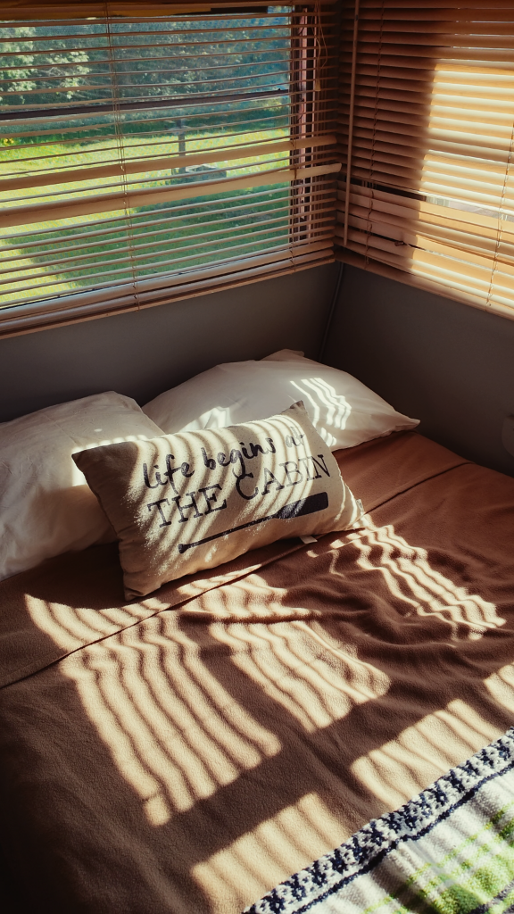 Luxury cabin interior with cedar walls and premium linen bedding