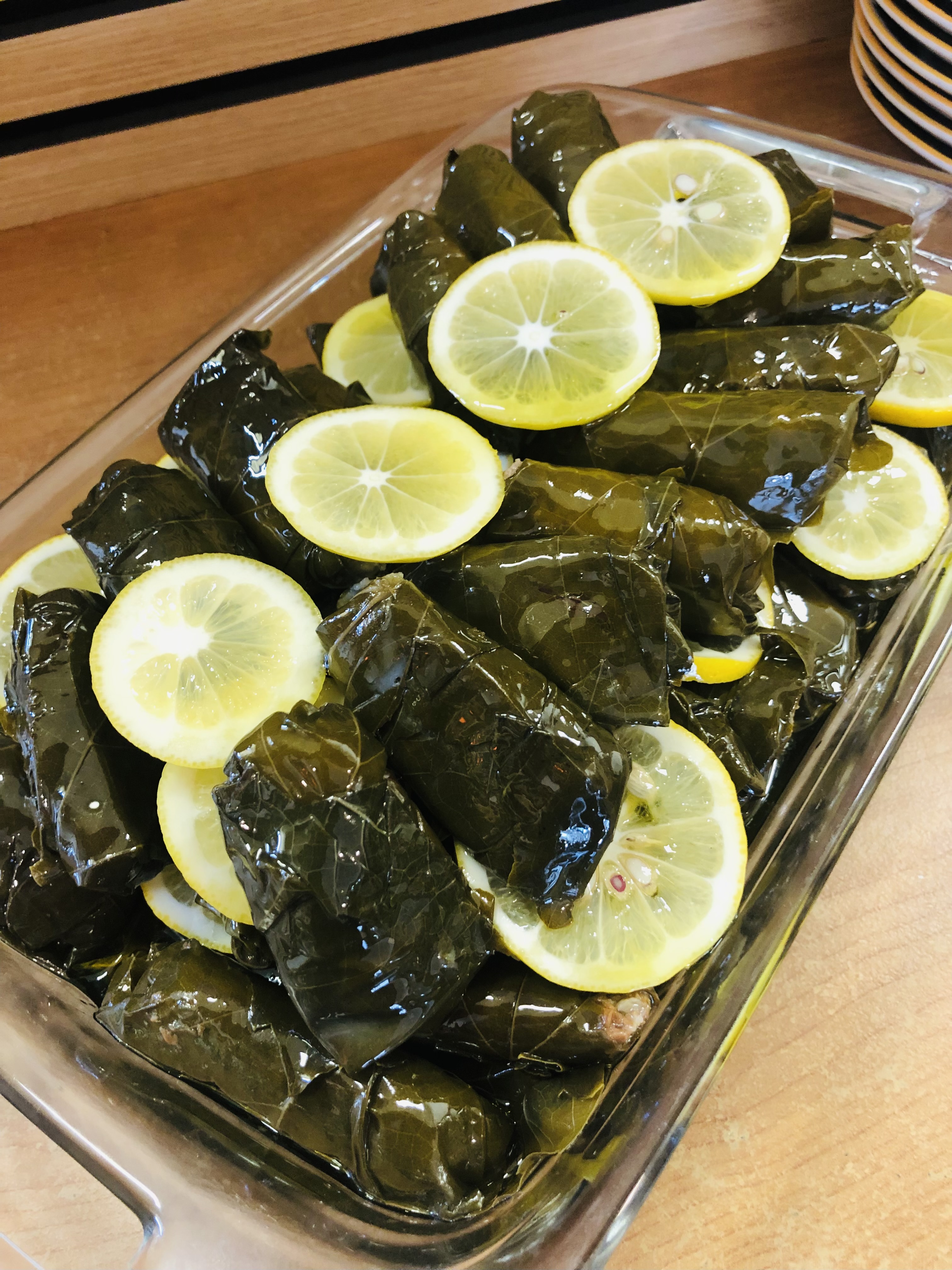 Stuffed vine leaves (sarma) with lemon slices