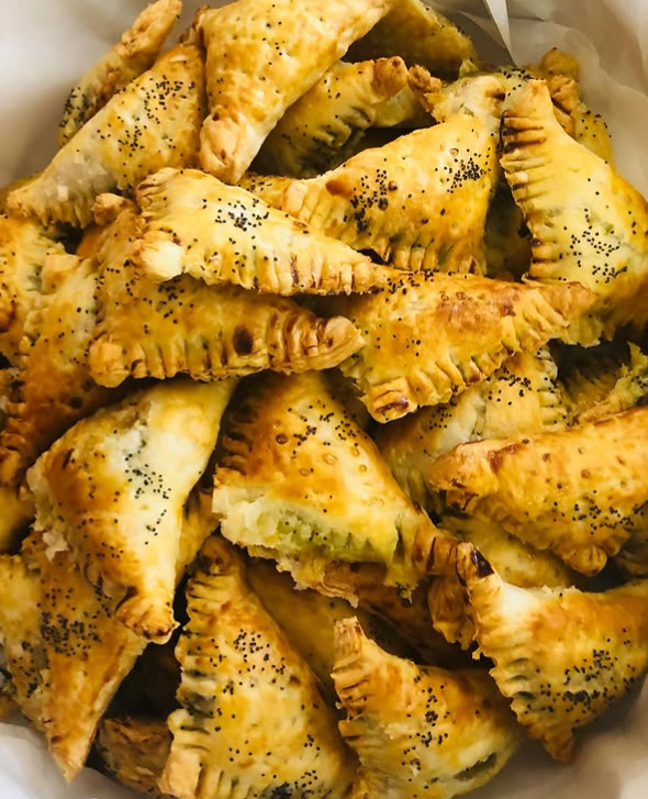 Golden baked borak pastries with poppy seeds