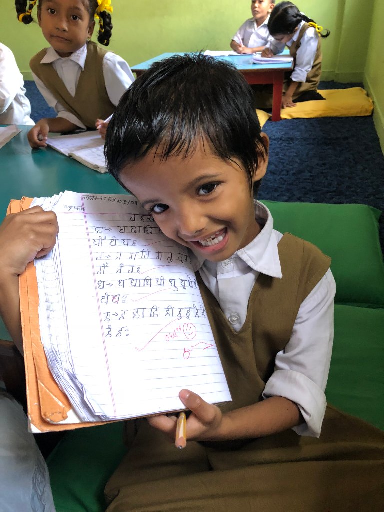 Student showing notebook