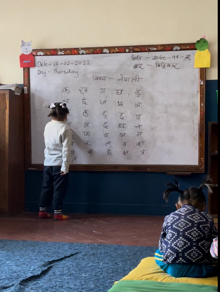 Child writing on whiteboard