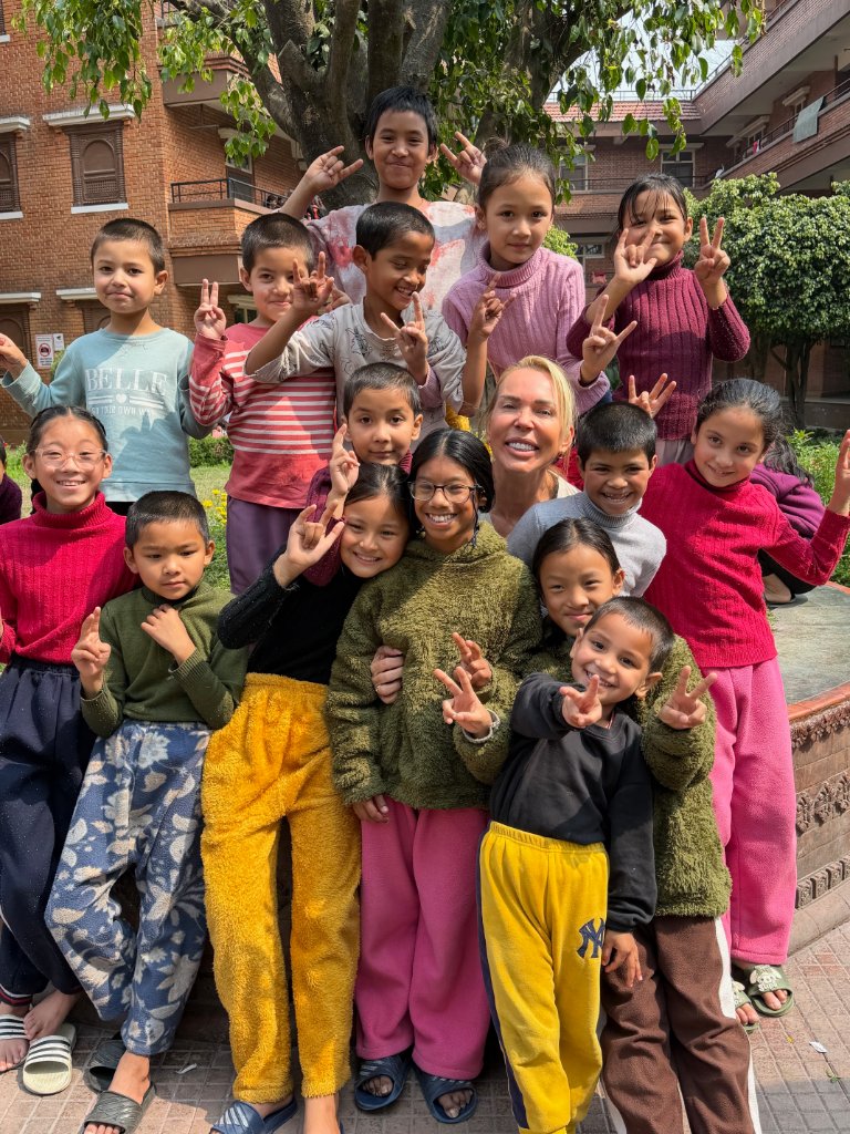 Marianne with children at Maiti Nepal