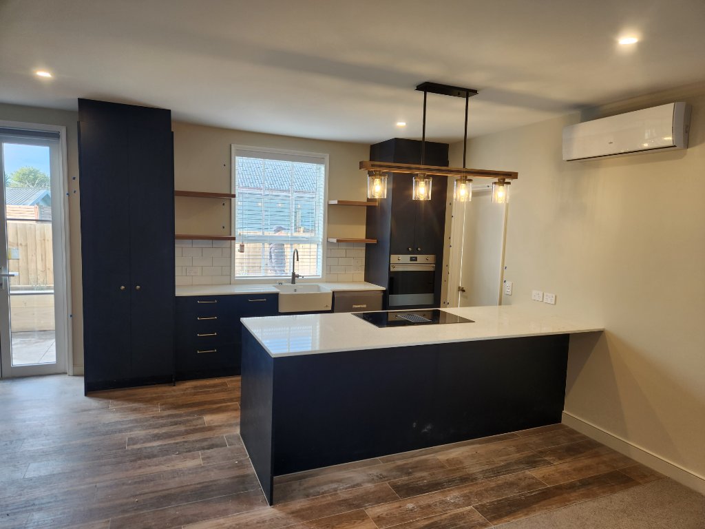 Navy kitchen with pendant lighting