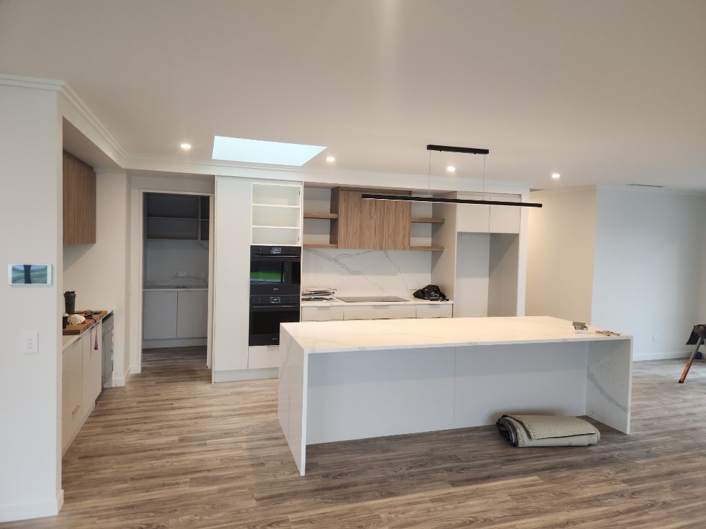 Kitchen with marble island and skylight