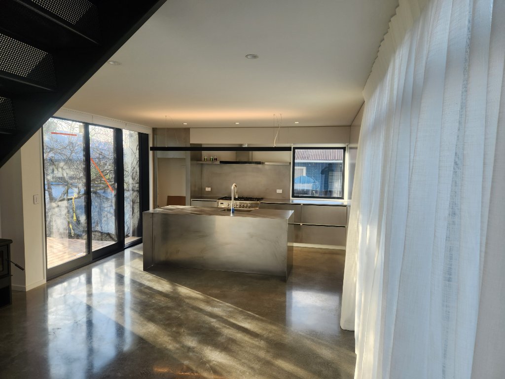 Stainless steel kitchen with island bench