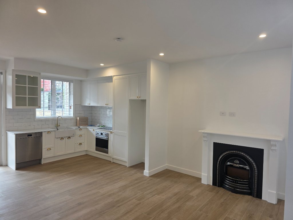 Classic white kitchen with fireplace