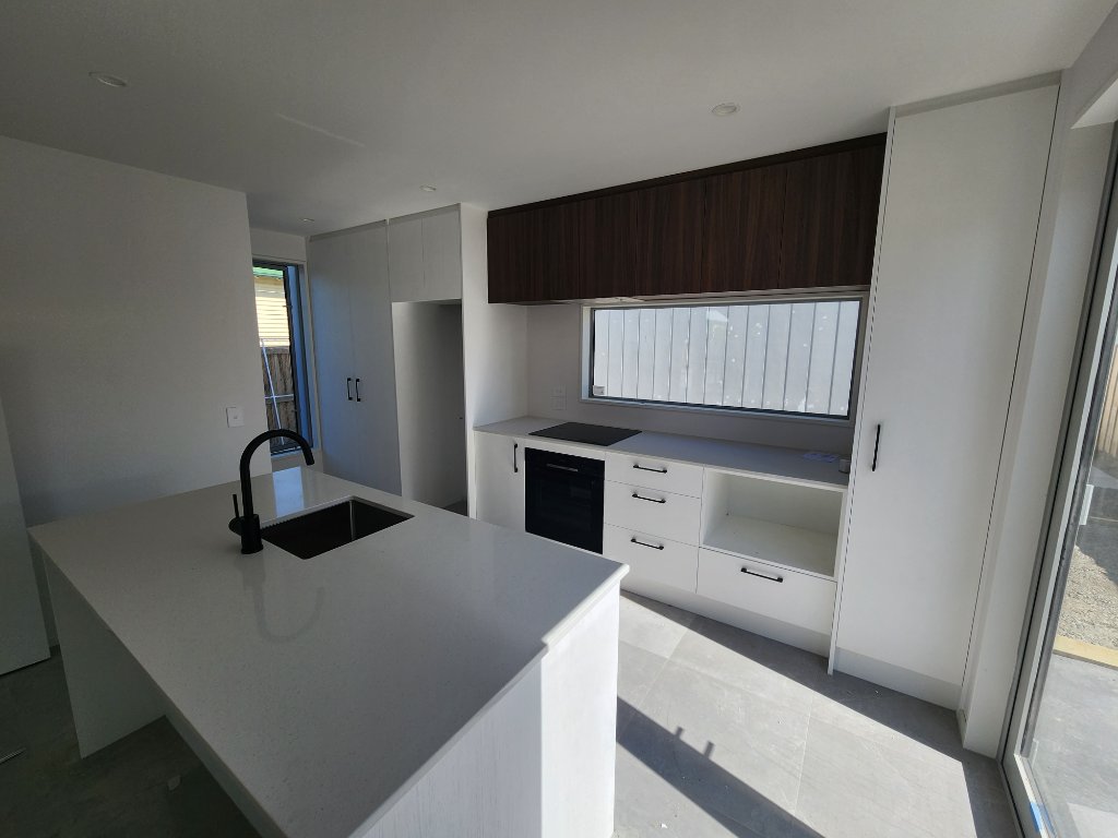 White kitchen with dark timber cabinetry