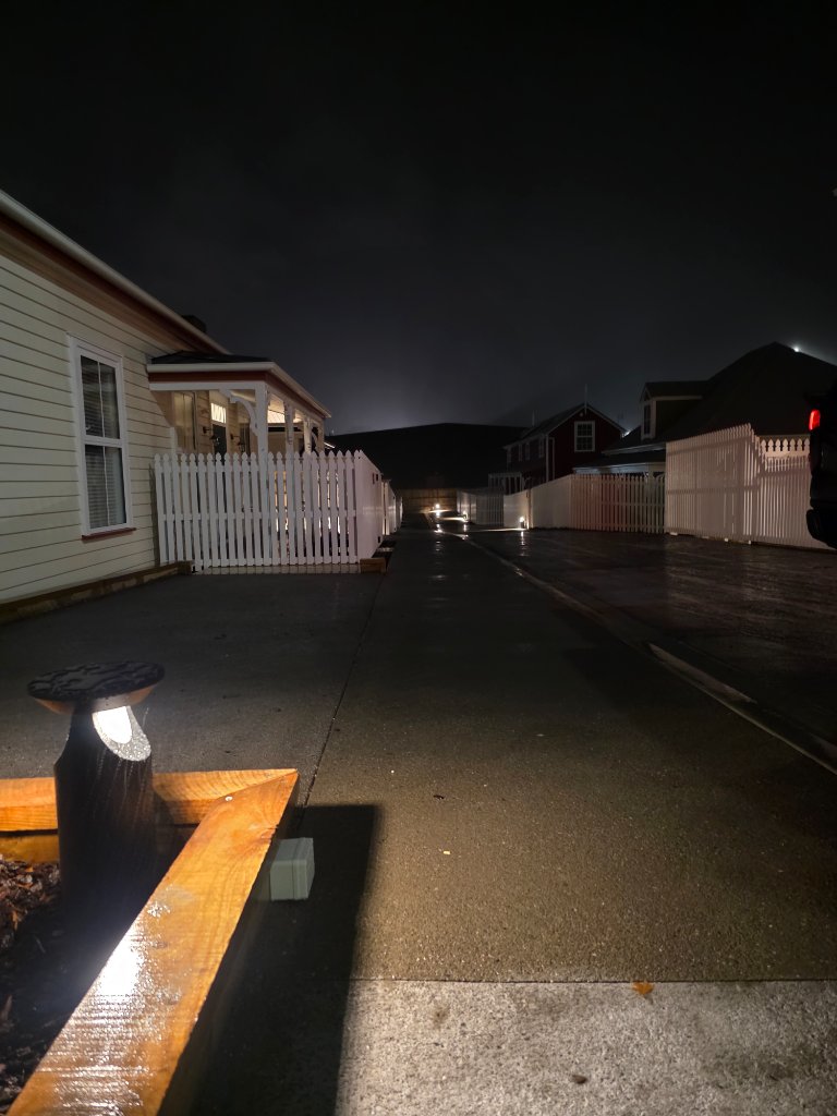 Driveway with bollard lighting at night