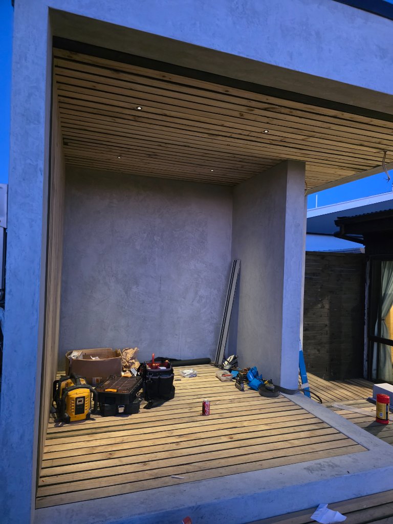 Outdoor nook with recessed ceiling lighting during construction
