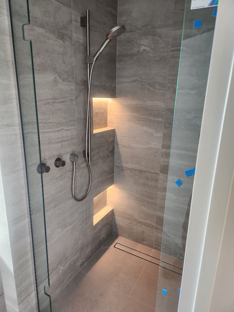 Shower niche with LED strip lighting