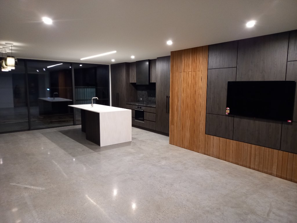 Open plan kitchen and living area with recessed lighting
