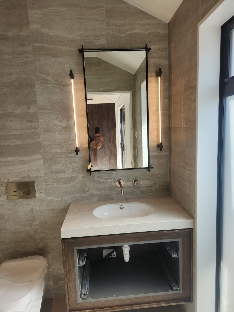 Bathroom vanity with wall sconces