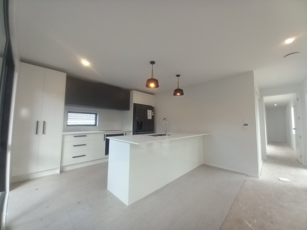 White kitchen with pendant lighting