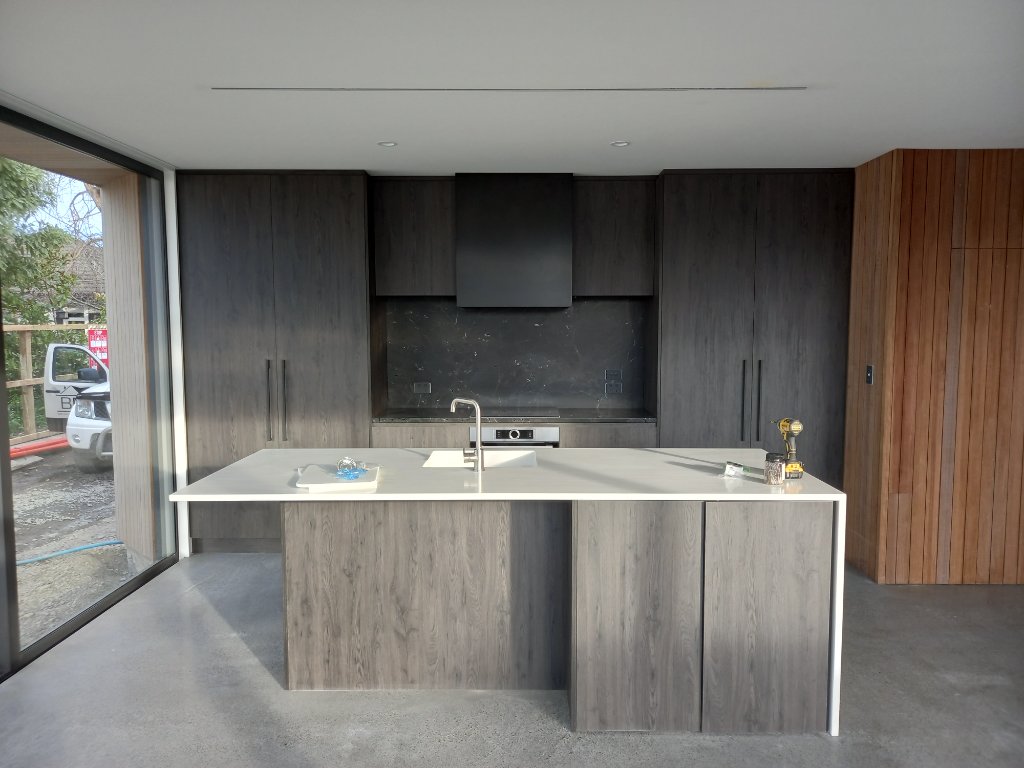 Kitchen island with timber accent wall