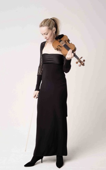 A violinist in a black evening gown performing at a Tinklings event