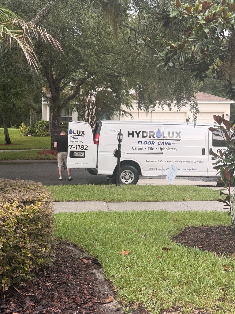 HydroLux Floor Care van parked in residential Wesley Chapel neighborhood