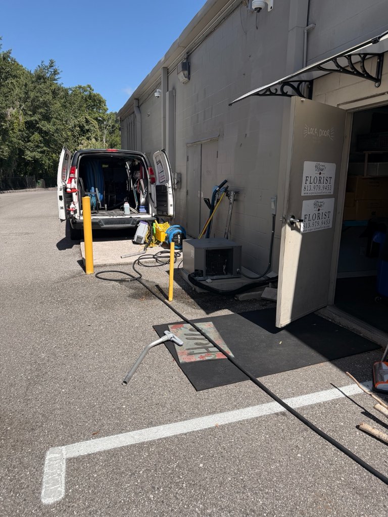 HydroLux Floor Care van and equipment set up outside commercial cleaning job