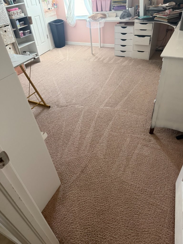Freshly cleaned beige carpet in residential craft room after HydroLux hot water extraction