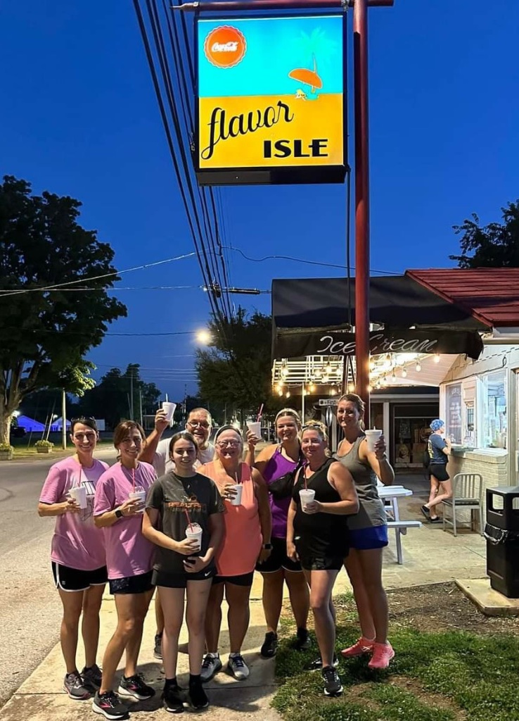 Guests gathered outside under the Flavor Isle sign