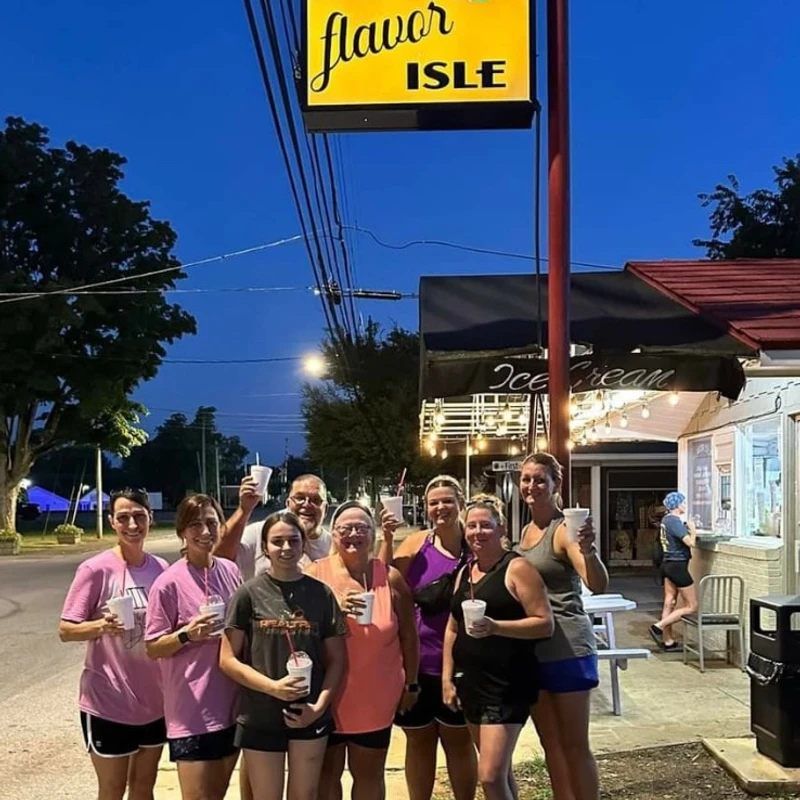 Guests gathered outside under the Flavor Isle sign