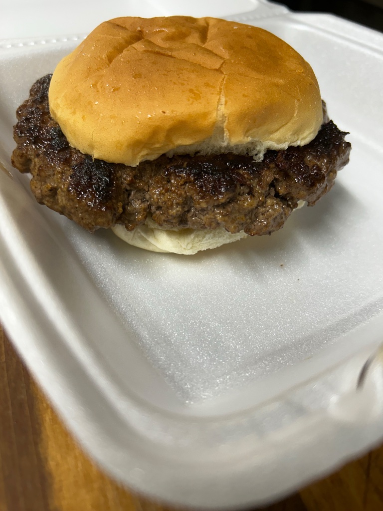 Hand-patted burger in a to-go box