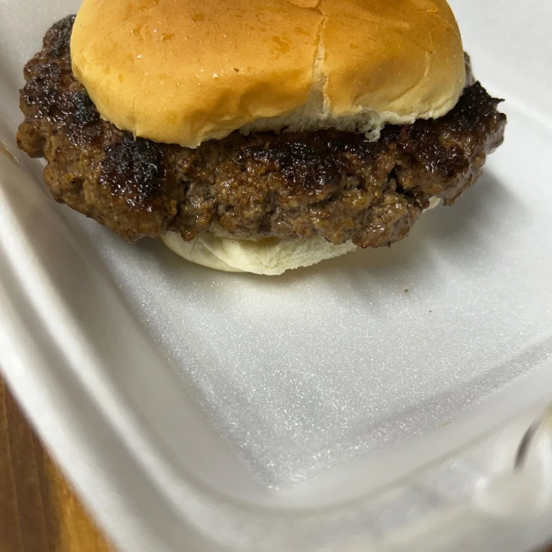 Hand-patted burger in a to-go box