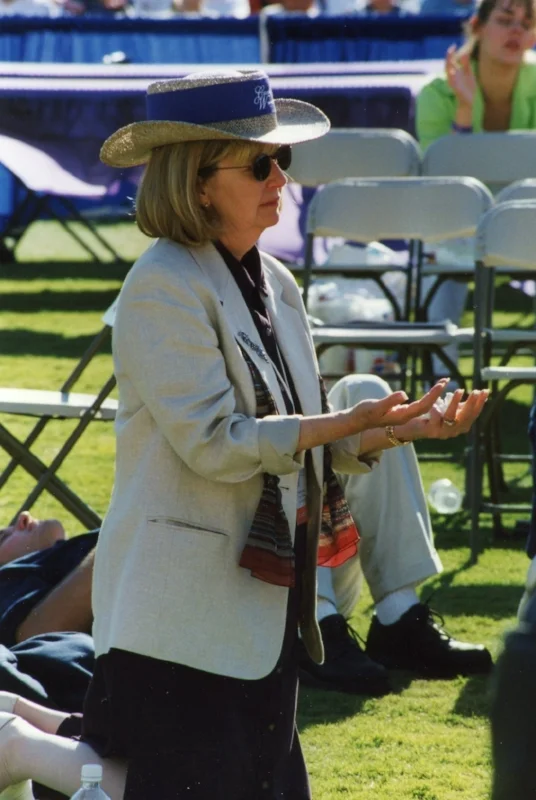 Attendee in prayer on the field
