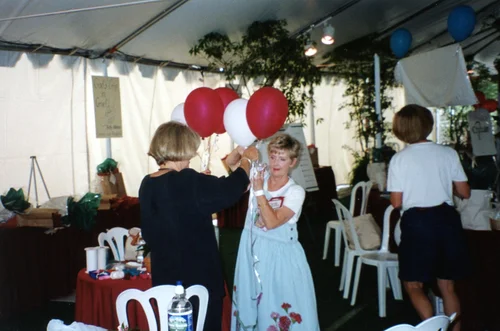 Volunteers preparing balloons under the tent