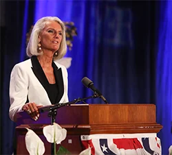 Anne Graham Lotz speaking at the podium