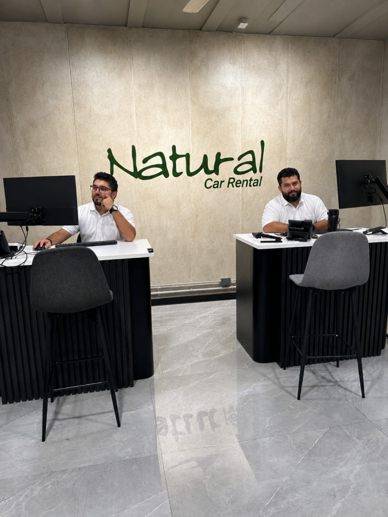 Team members attending the Natural Car Rental reception area.