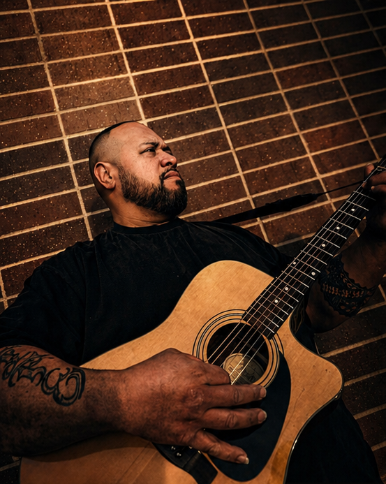 Alo Key, R&B and Soul recording artist performing with acoustic guitar at Luau Night