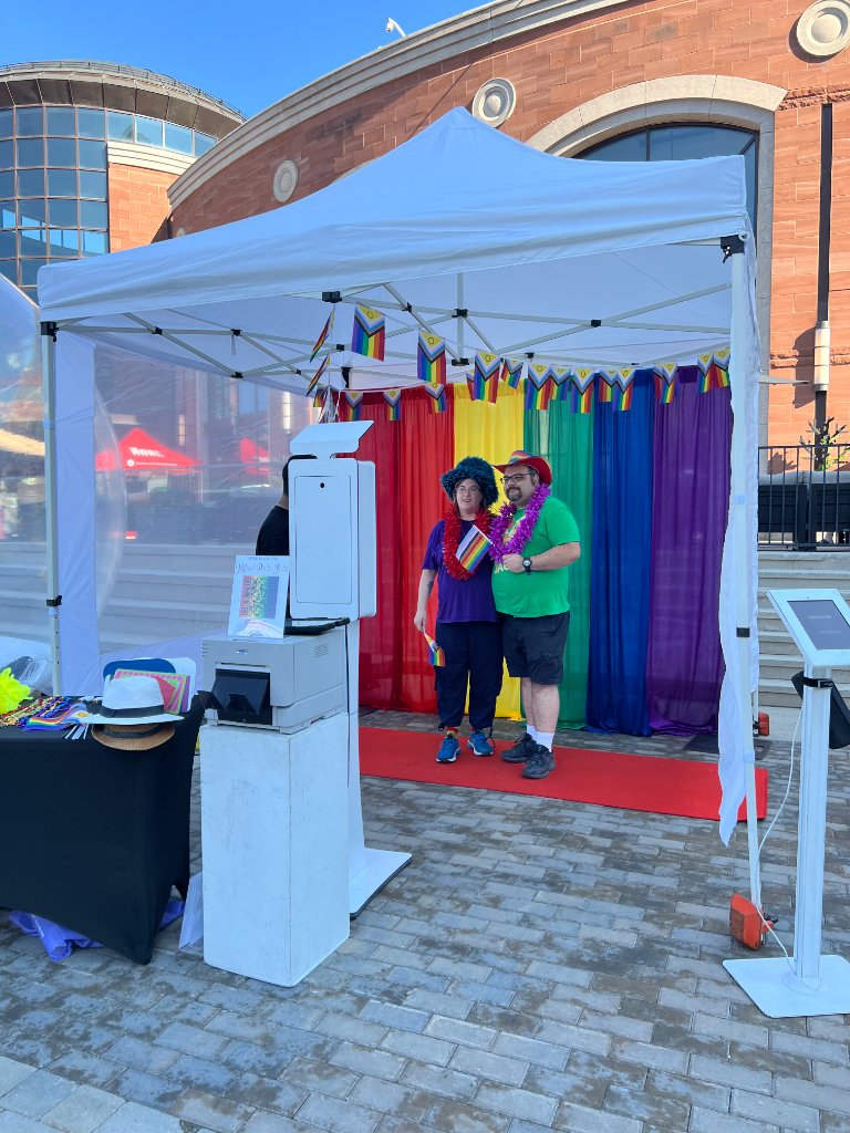 IMAGICA DSLR photo booth with rainbow backdrop in branded tent at Brampton Pride 2026