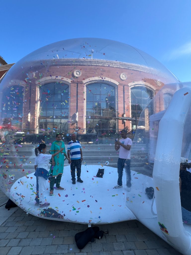 IMAGICA inflatable bubble dome interior with confetti at Brampton Pride outdoor event