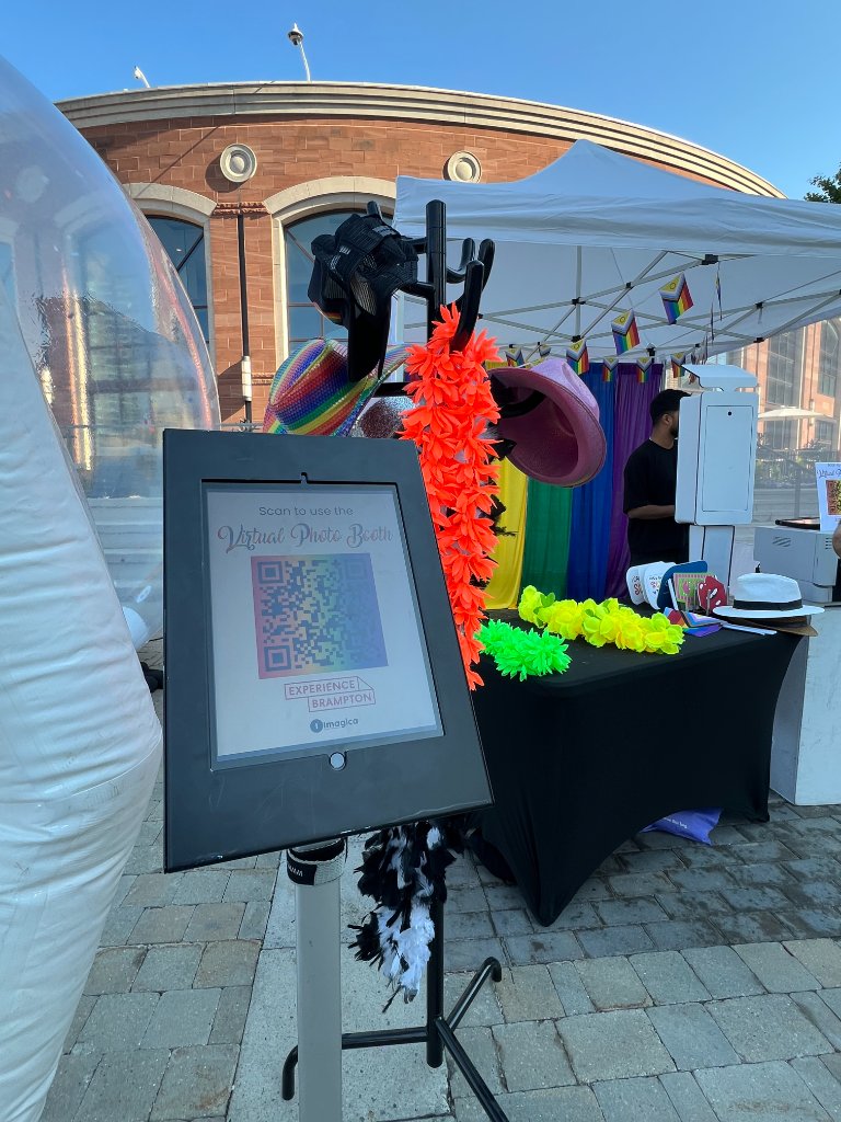 IMAGICA Virtual Photo Booth kiosk with props and bubble dome at Brampton Pride event