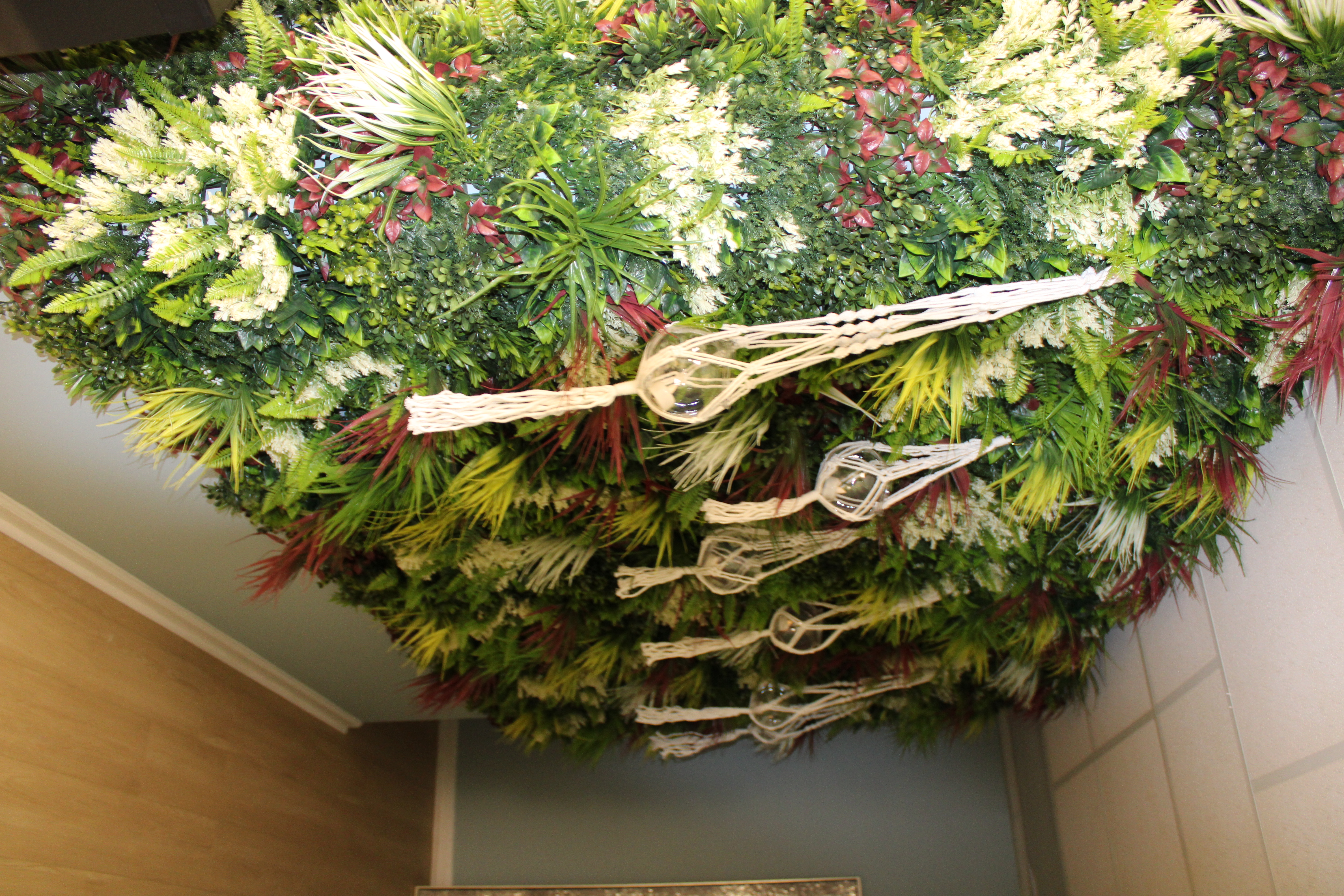 Living wall with macrame hanging candles