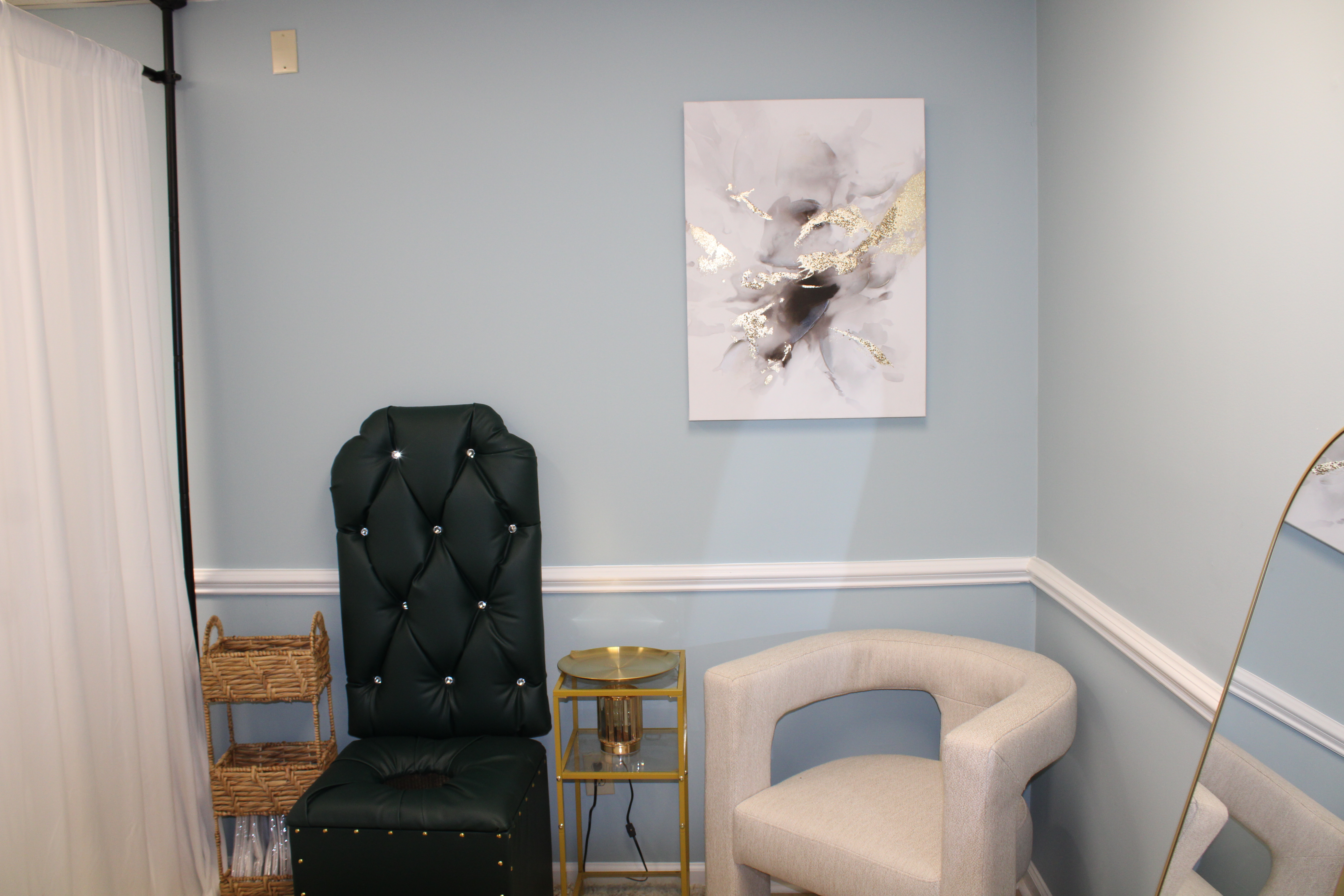 Private steam room with a tufted steam chair and art