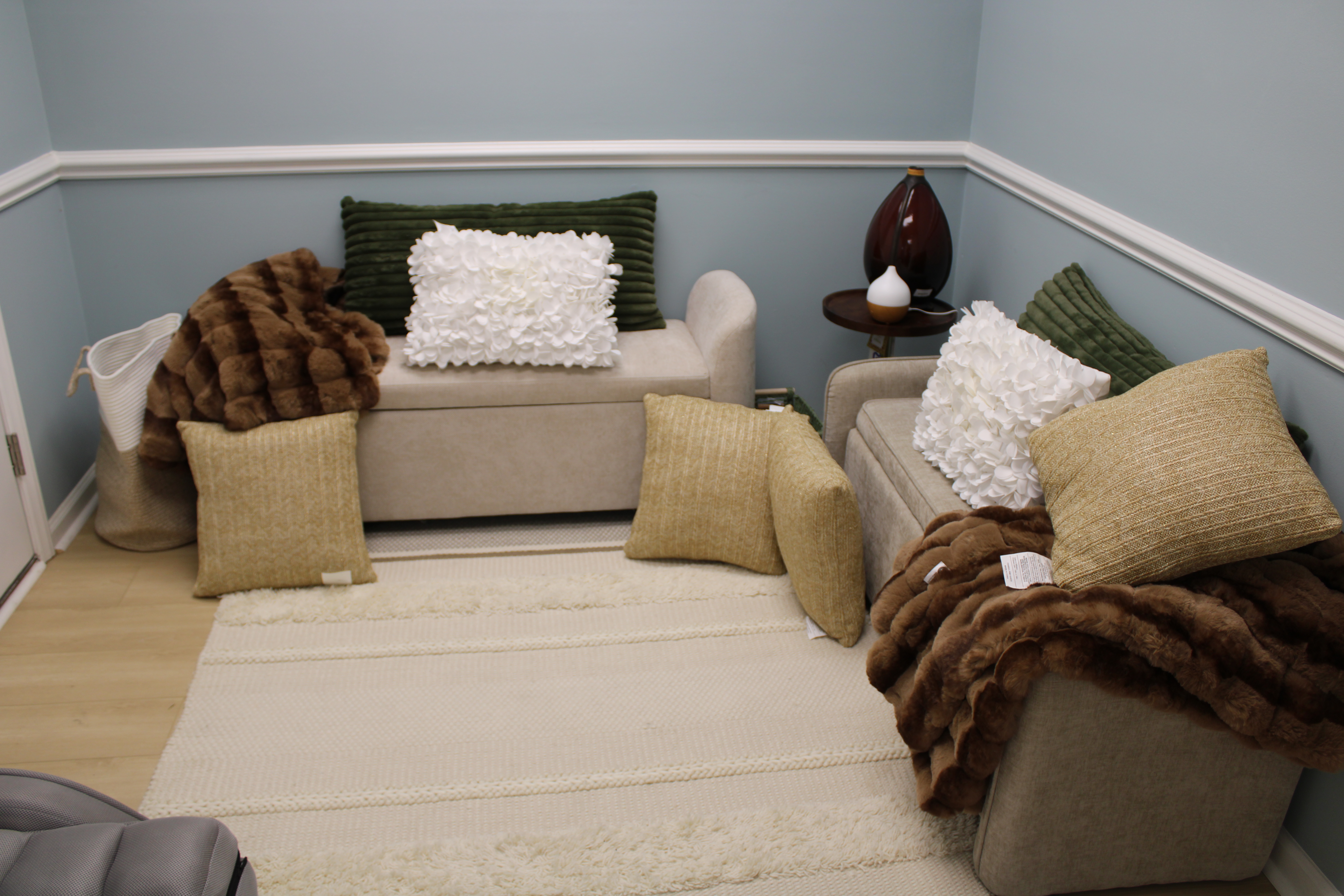 Cozy circle room with pillows and throws