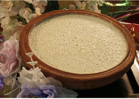 Mishti Doi — traditional Bengali sweetened yogurt served in a terracotta bowl