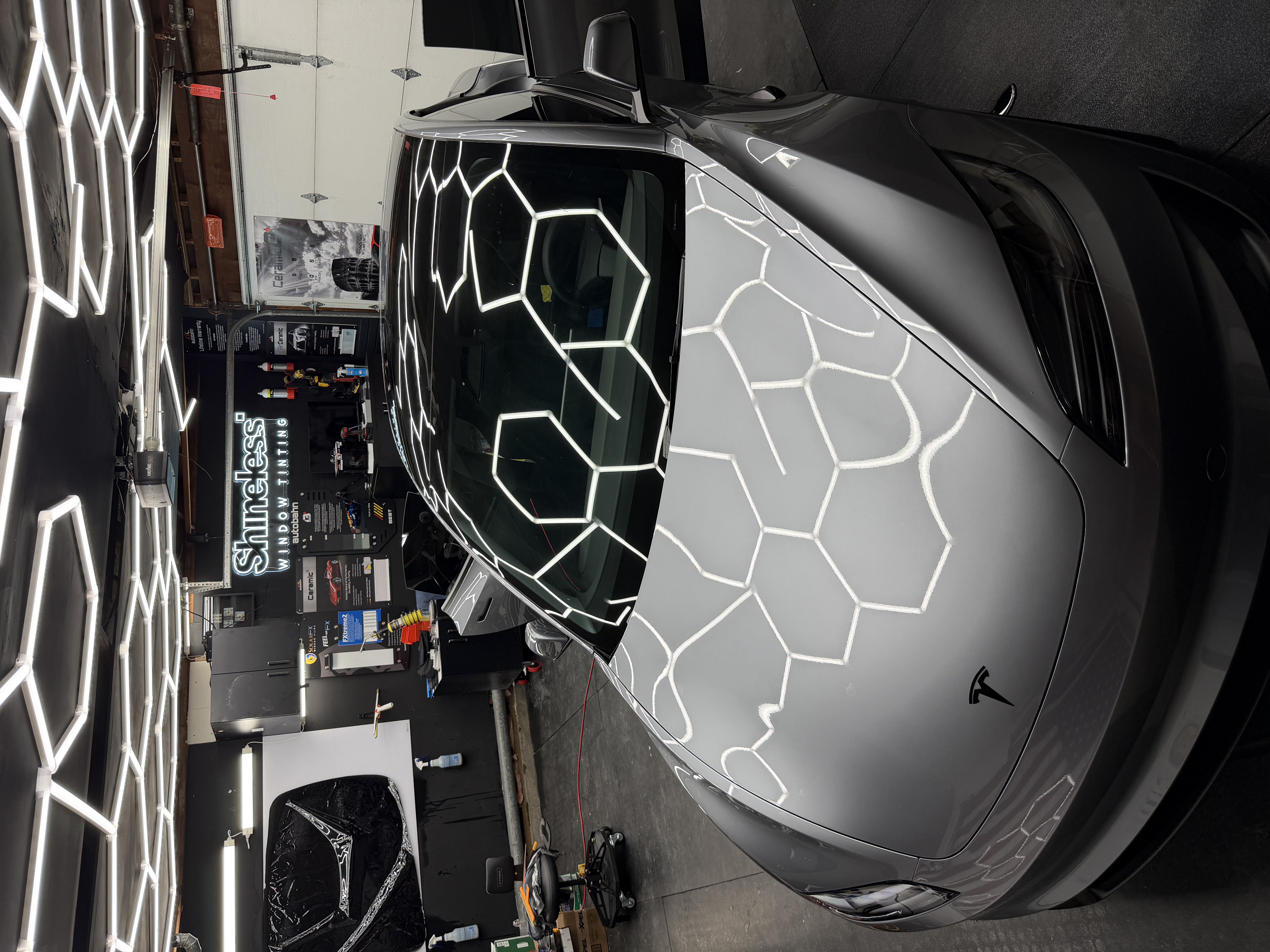 Tesla receiving high-end ceramic window tint in the Shineless workshop